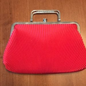 Pleated Clutch purse w shoulder strap, top clasp and rhinestoned handle.